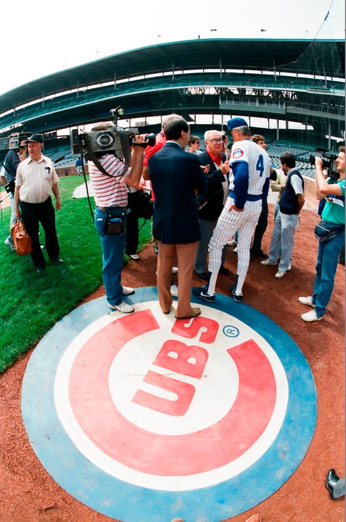 Harry Caray greeting fans and players at Wrigley Field - Chicago Sun-Times
