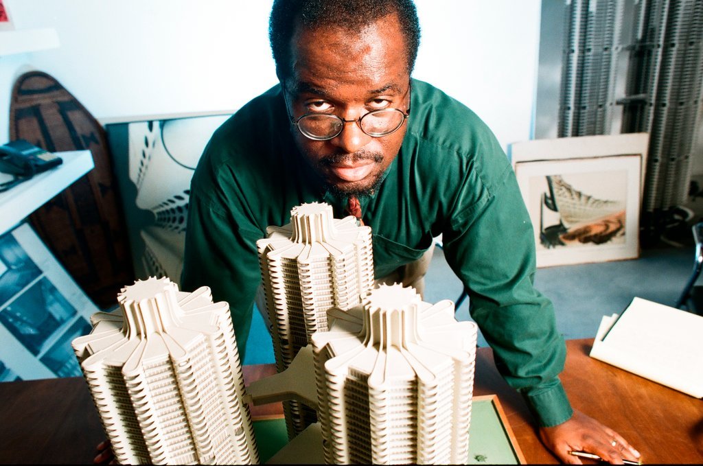 Sun-Times writer Lee Bey with model of Marina City - Rich Hein for Chicago Sun-Times