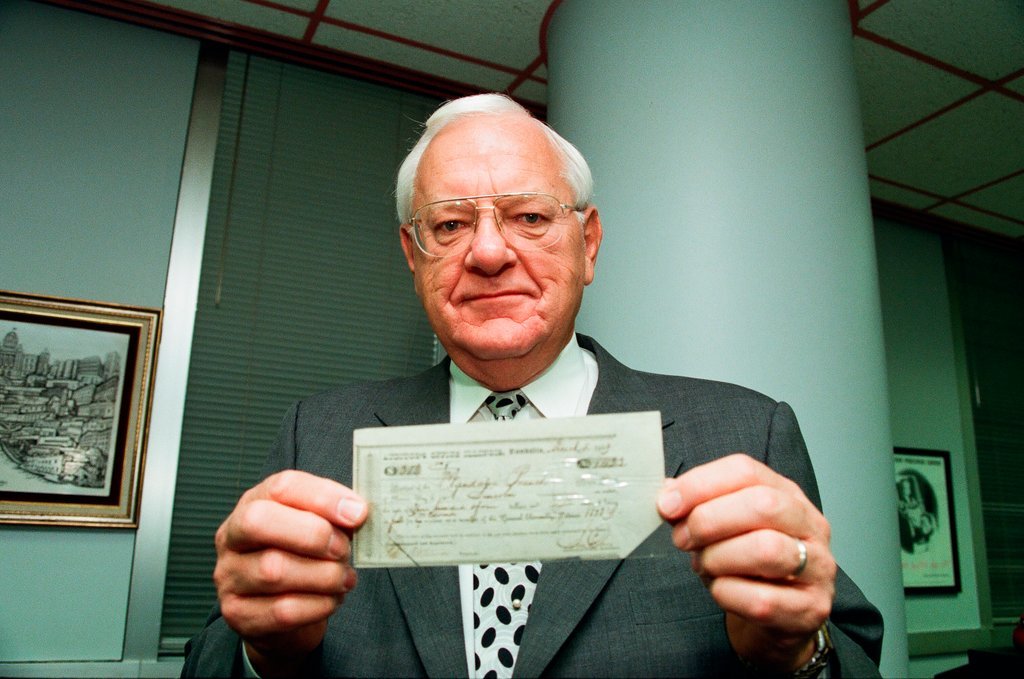 George Ryan holds Lincoln check - Chicago Sun-Times