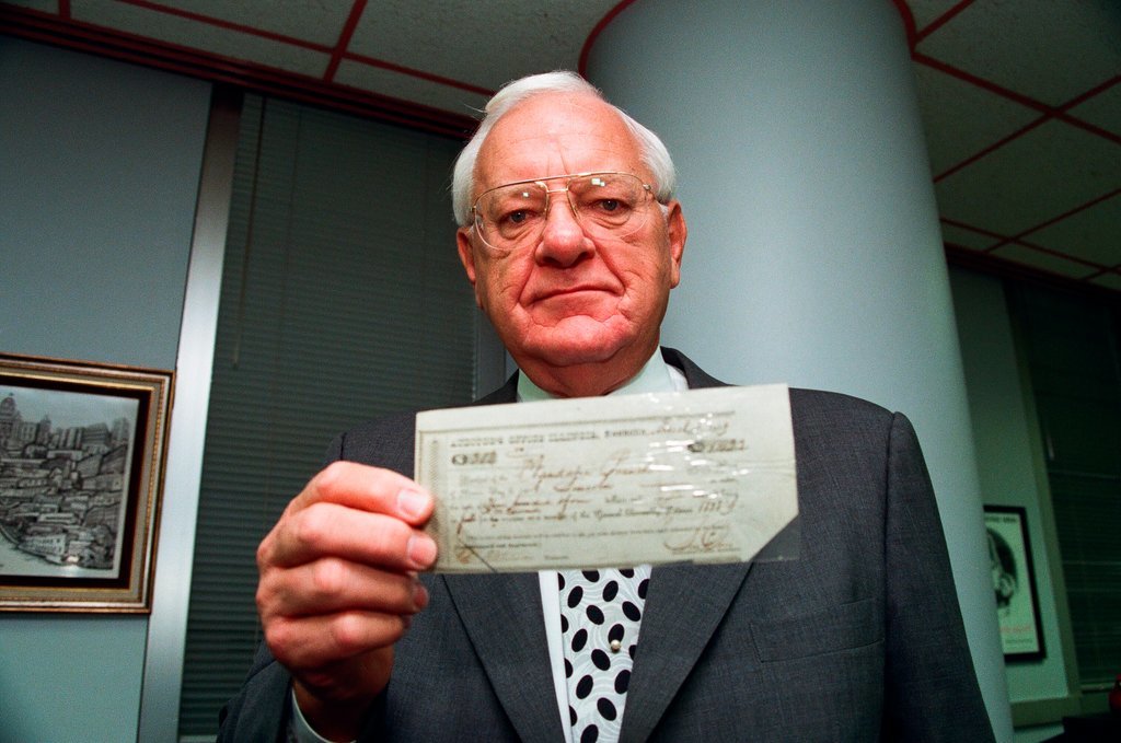 George Ryan holds Lincoln check - Chicago Sun-Times