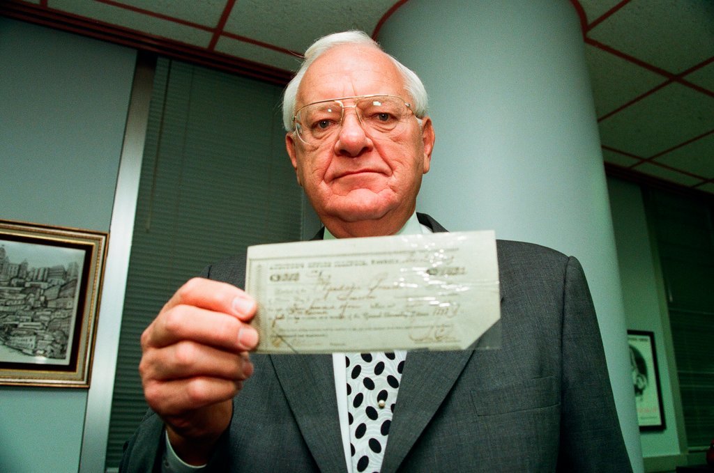 George Ryan holds Lincoln check - Chicago Sun-Times