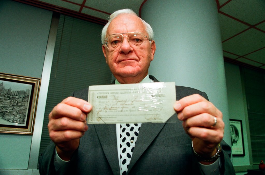 George Ryan holds Lincoln check - Chicago Sun-Times