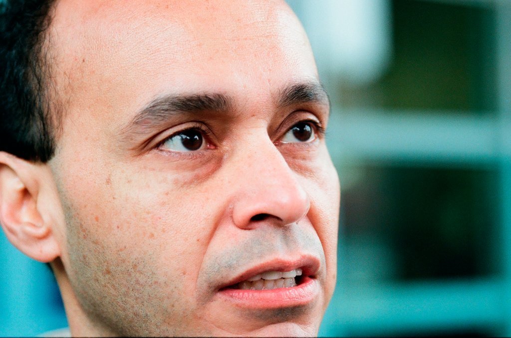 Luis Gutierrez passes out fliers at CTA station - Chicago Sun-Times