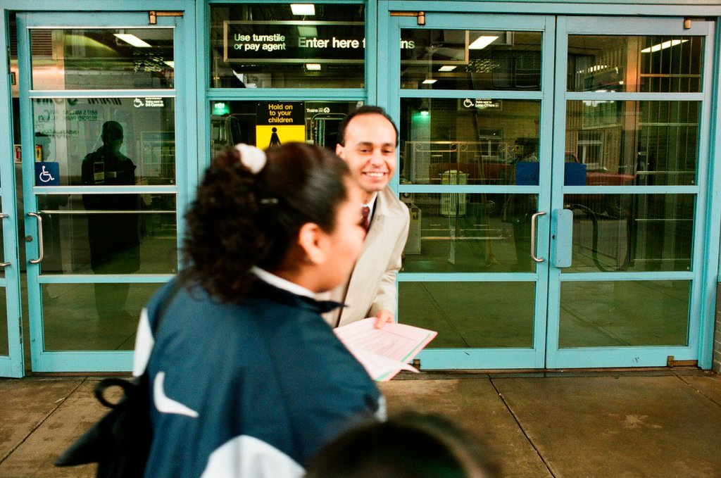 Luis Gutierrez passes out fliers at CTA station - Chicago Sun-Times