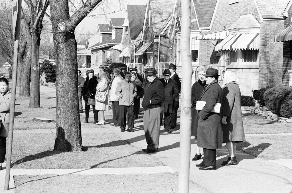 Parents and children stand outside Lyon School - Chicago Sun-Times