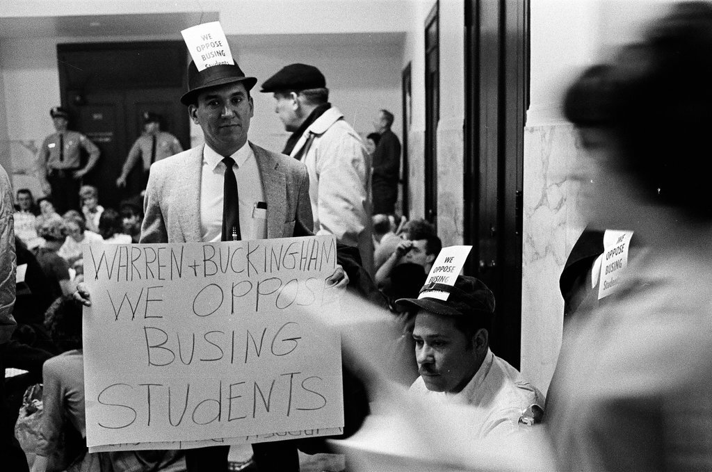 Busing protesters wearing signs - Chicago Sun-Times