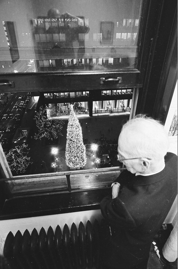 Man looking at the Civic Center Christmas tree from his window - Chicago Sun-Times