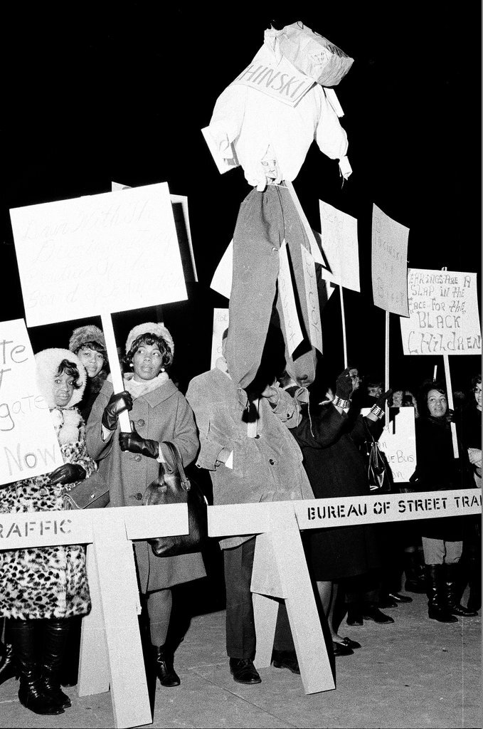 People hold signs in support of busing - Chicago Sun-Times