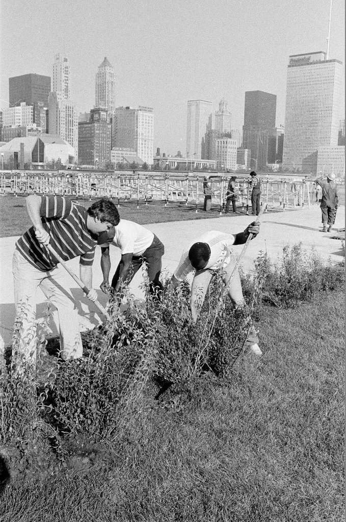 Volunteers work on altar in Grant Park - John H. White for Chicago Sun-Times
