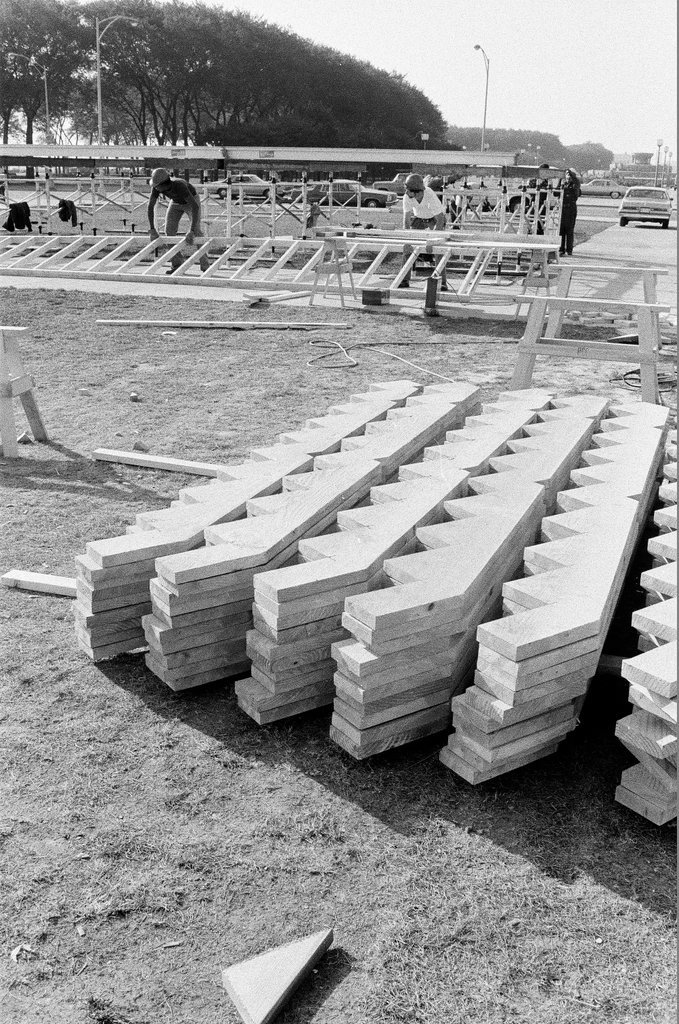 Volunteers work on altar in Grant Park - John H. White for Chicago Sun-Times