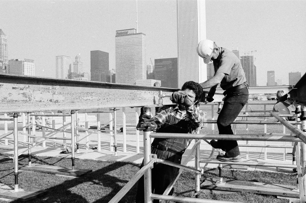 Volunteers work on altar in Grant Park - John H. White for Chicago Sun-Times