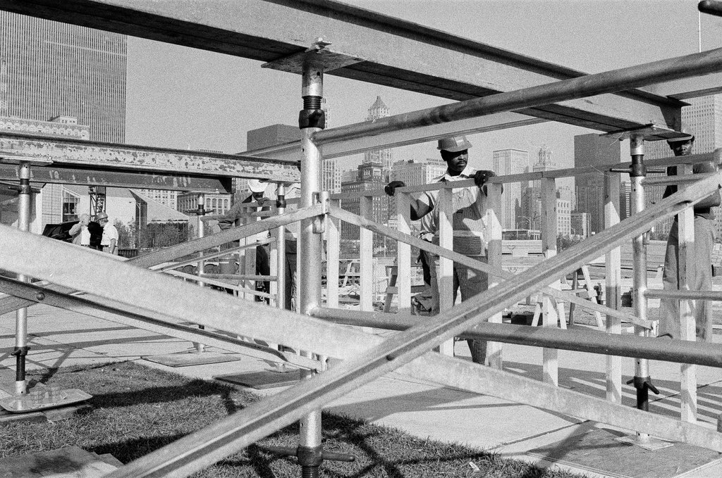 Volunteers work on altar in Grant Park - John H. White for Chicago Sun-Times
