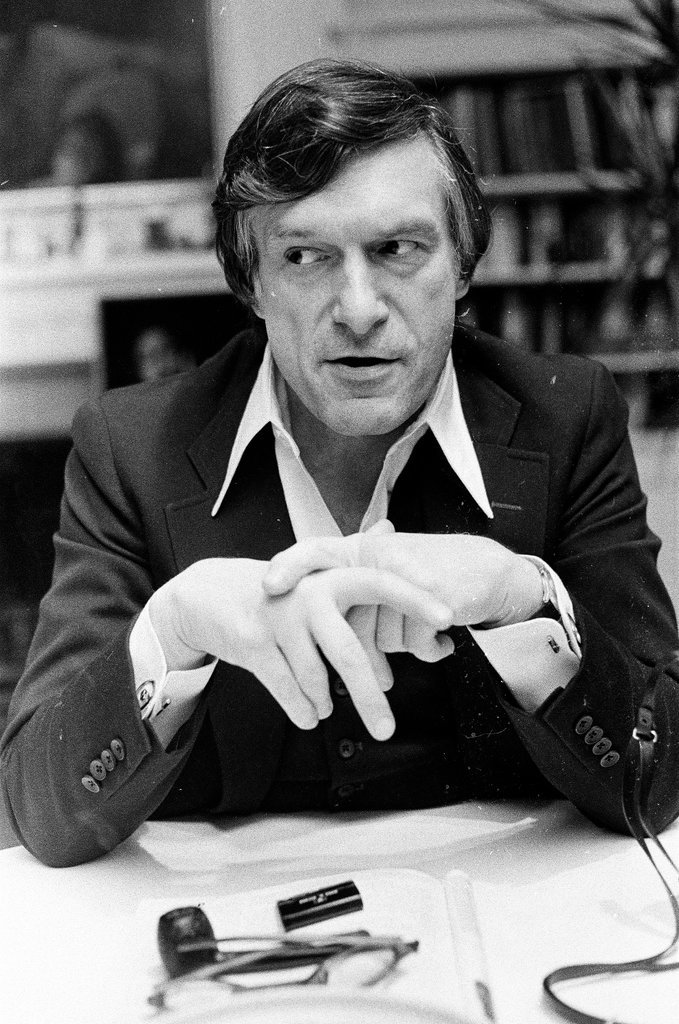 Hugh Hefner sits at desk - Chicago Sun-Times