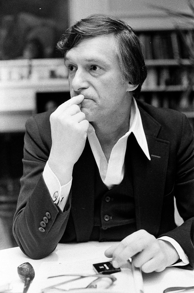 Hugh Hefner sits at desk - Chicago Sun-Times