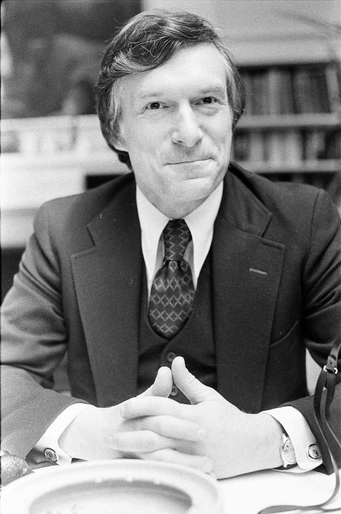 Hugh Hefner sits at desk - Chicago Sun-Times