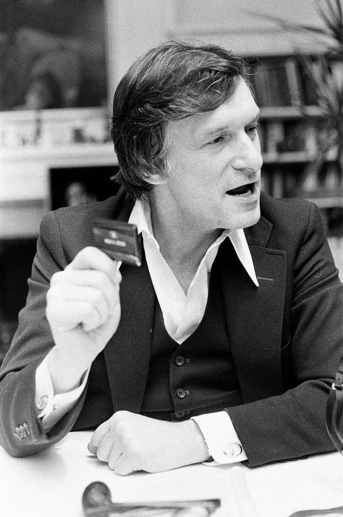 Hugh Hefner sits at desk - Chicago Sun-Times