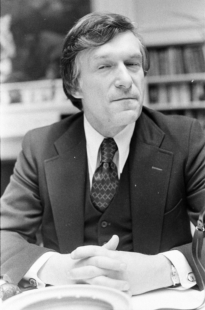 Hugh Hefner sits at desk - Chicago Sun-Times