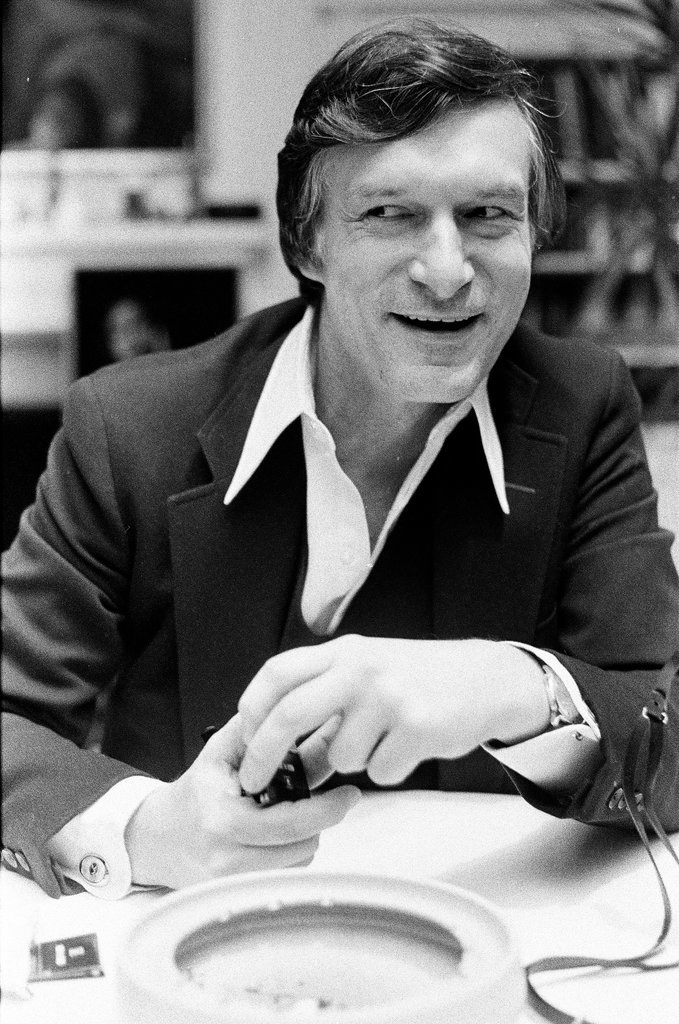 Hugh Hefner sits at desk - Chicago Sun-Times