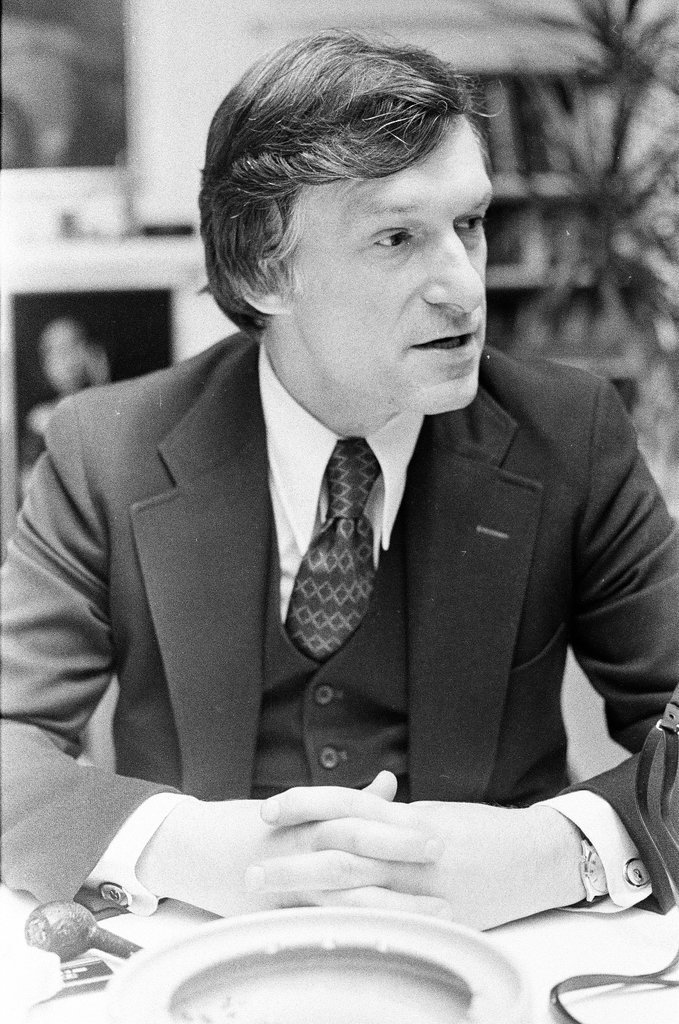 Hugh Hefner sits at desk - Chicago Sun-Times