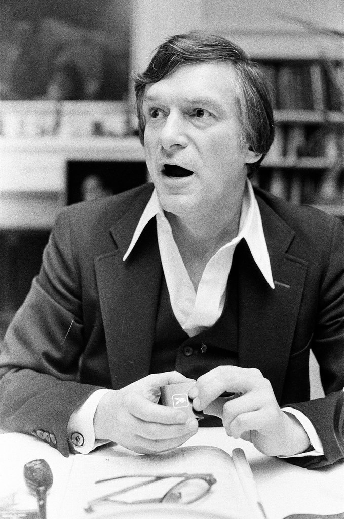 Hugh Hefner sits at desk - Chicago Sun-Times