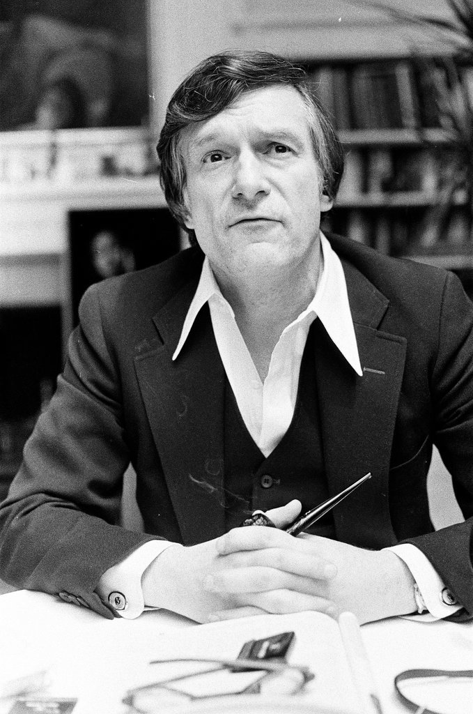Hugh Hefner sits at desk - Chicago Sun-Times
