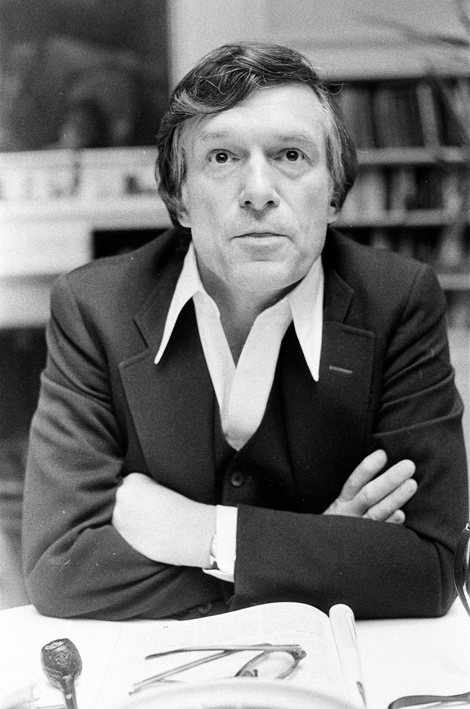 Hugh Hefner sits at desk - Chicago Sun-Times