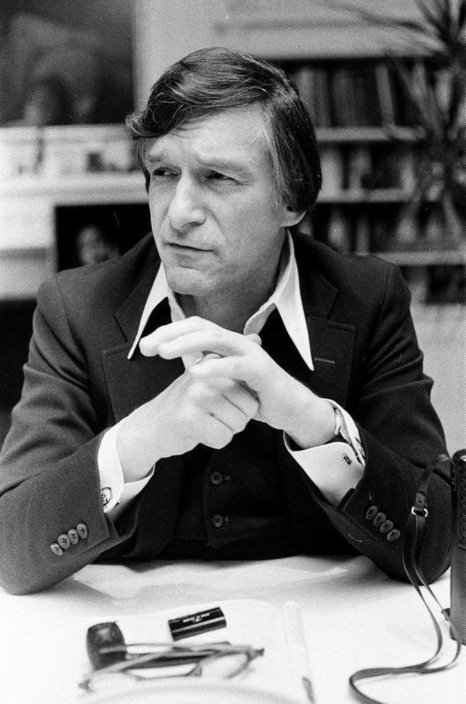 Hugh Hefner sits at desk - Chicago Sun-Times