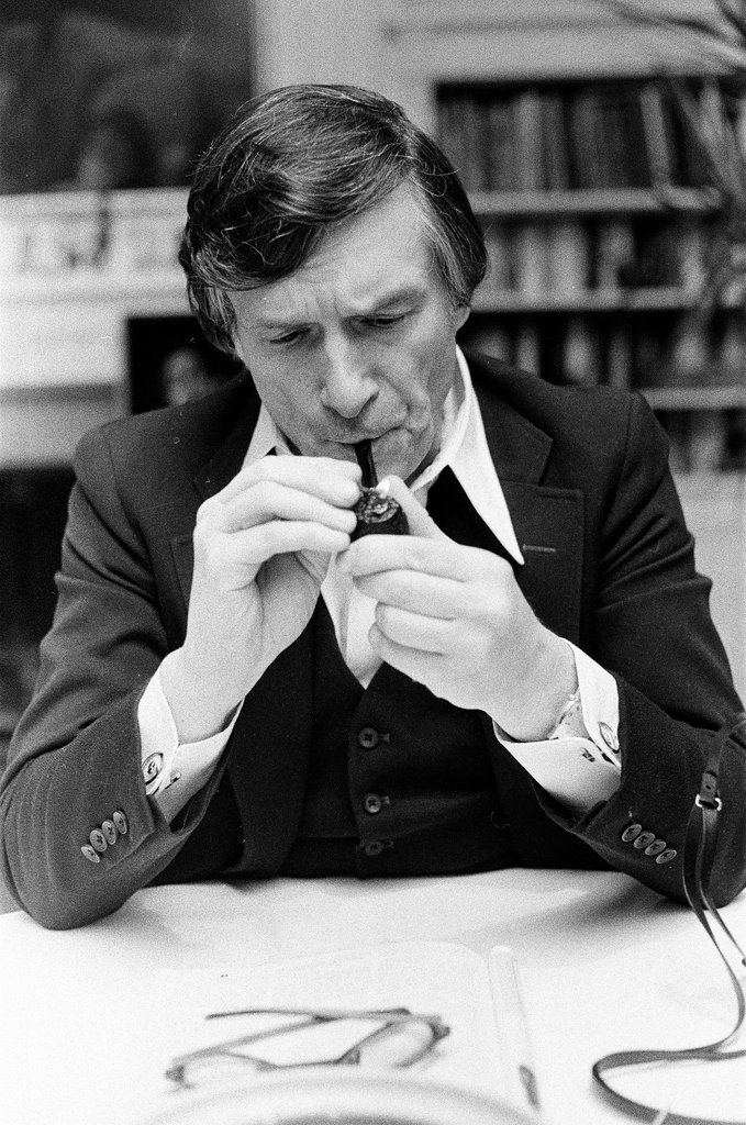 Hugh Hefner sits at desk - Chicago Sun-Times