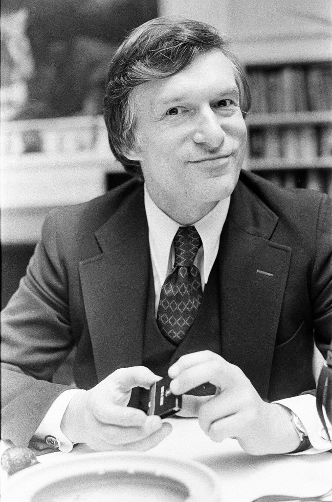 Hugh Hefner sits at desk - Chicago Sun-Times