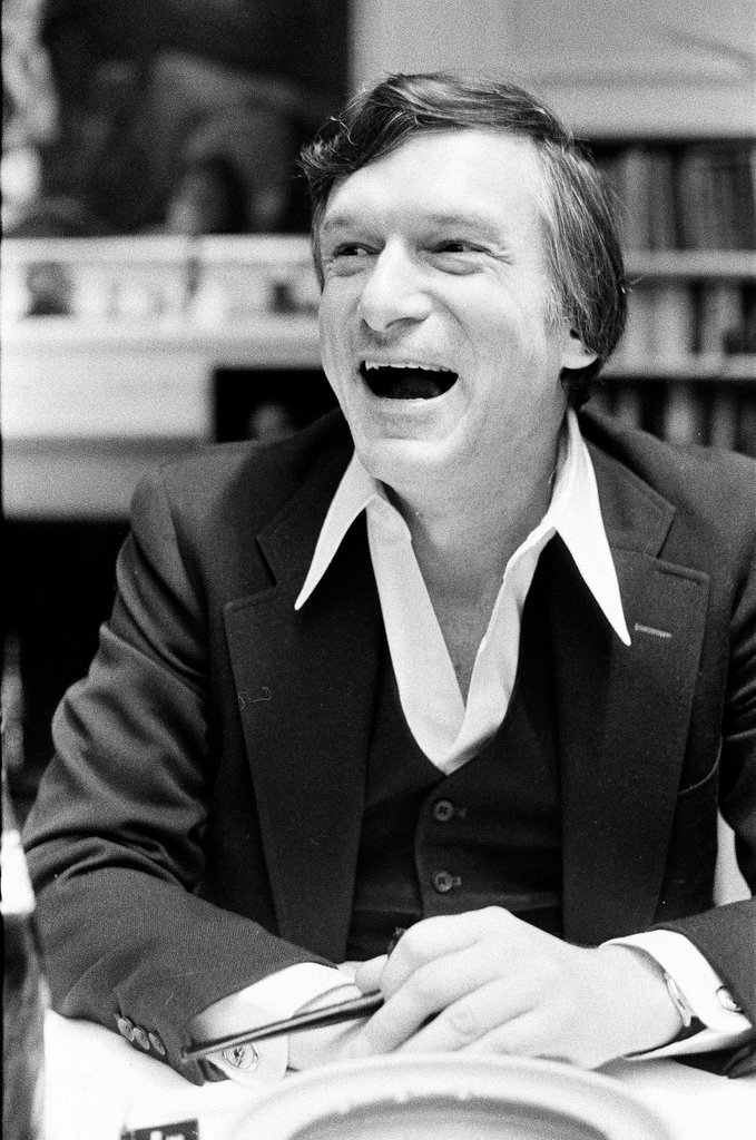Hugh Hefner sits at desk - Chicago Sun-Times