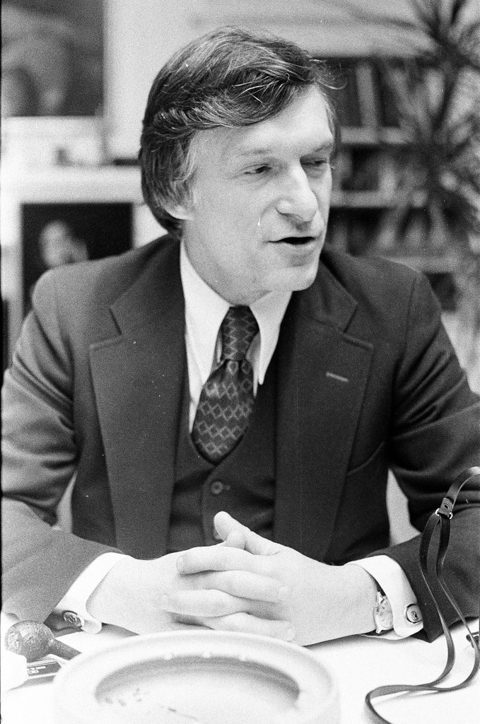 Hugh Hefner sits at desk - Chicago Sun-Times