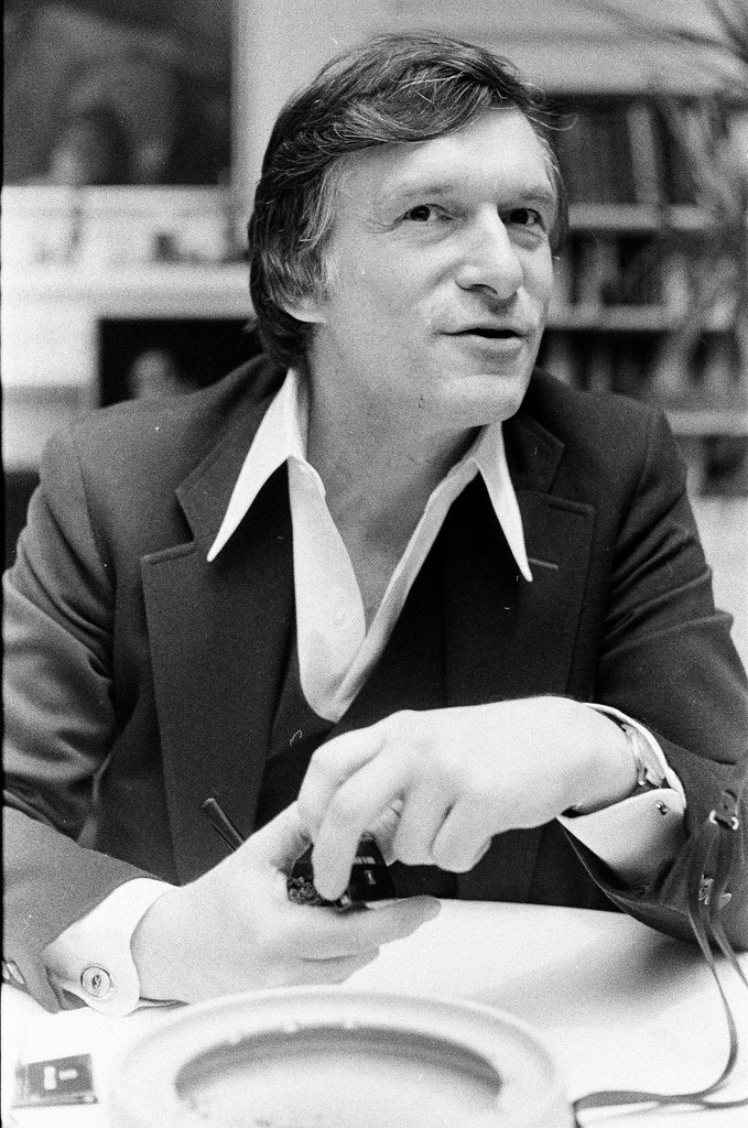 Hugh Hefner sits at desk - Chicago Sun-Times