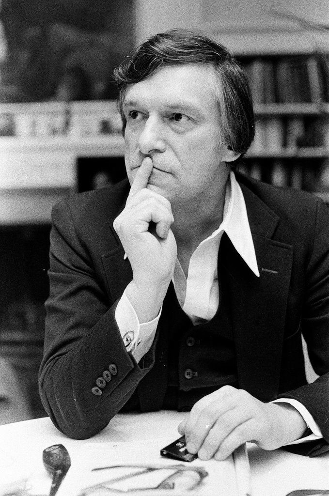 Hugh Hefner sits at desk - Chicago Sun-Times