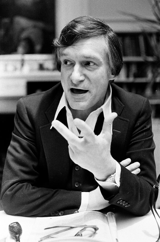 Hugh Hefner sits at desk - Chicago Sun-Times