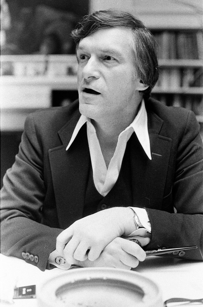 Hugh Hefner sits at desk - Chicago Sun-Times