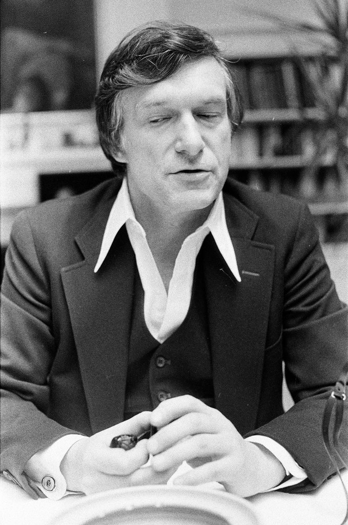 Hugh Hefner sits at desk - Chicago Sun-Times