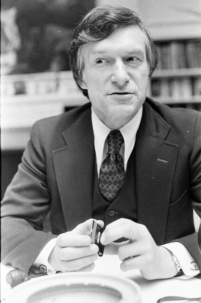 Hugh Hefner sits at desk - Chicago Sun-Times