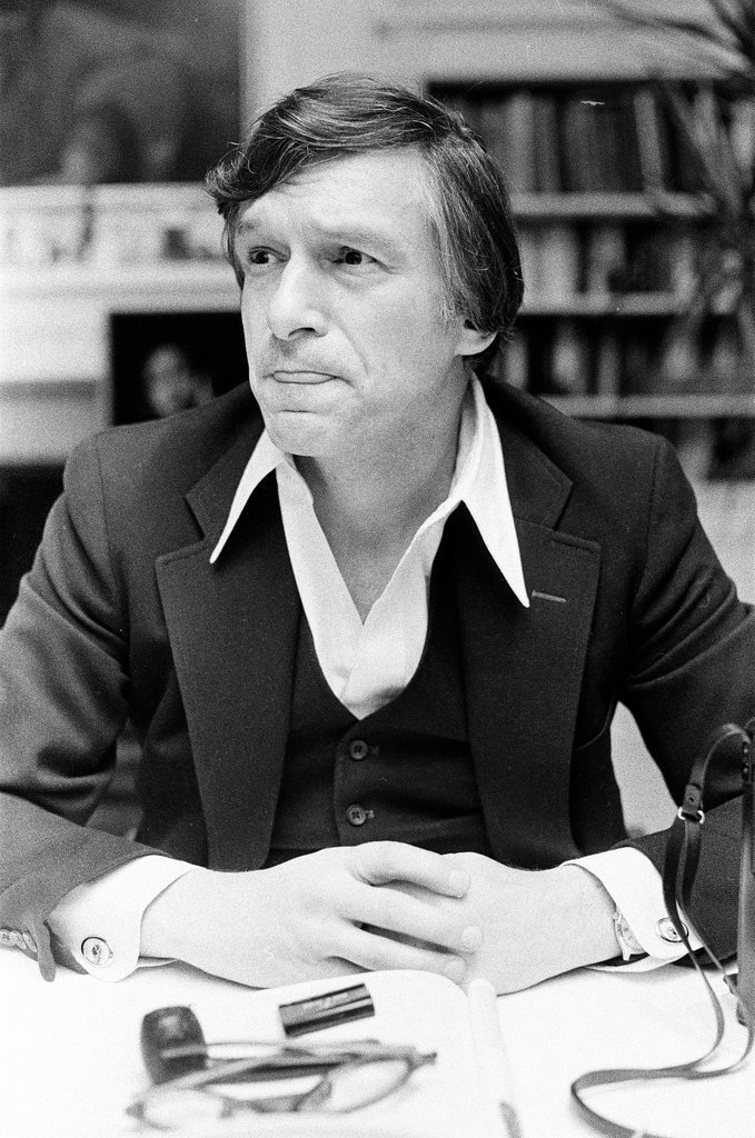 Hugh Hefner sits at desk - Chicago Sun-Times