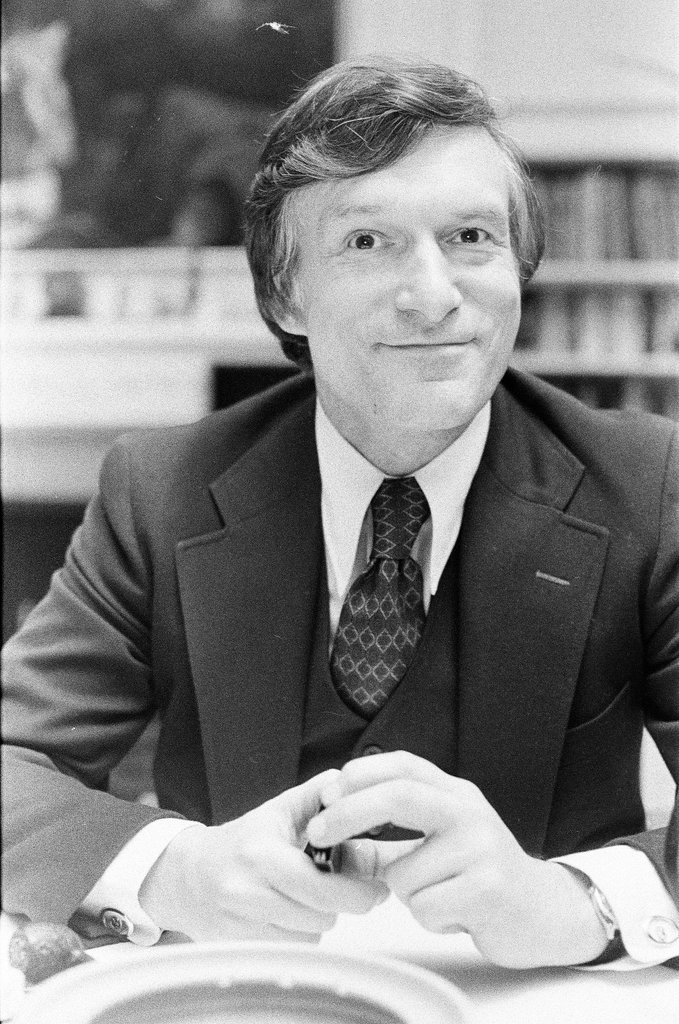 Hugh Hefner sits at desk - Chicago Sun-Times