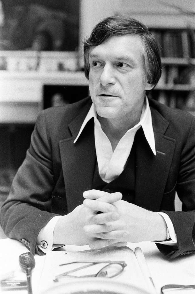 Hugh Hefner sits at desk - Chicago Sun-Times
