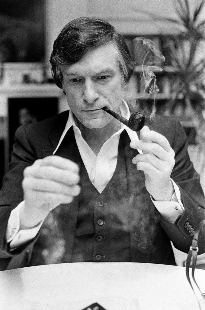 Hugh Hefner sits at desk - Chicago Sun-Times