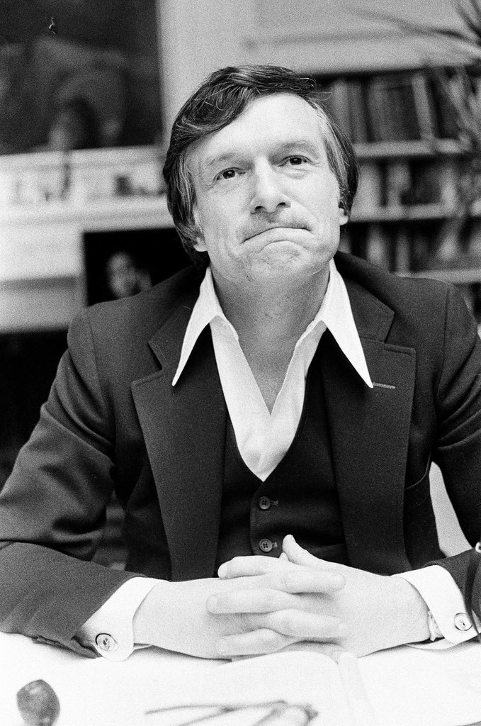 Hugh Hefner sits at desk - Chicago Sun-Times