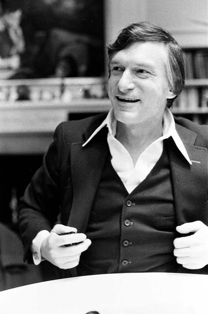 Hugh Hefner sits at desk - Chicago Sun-Times