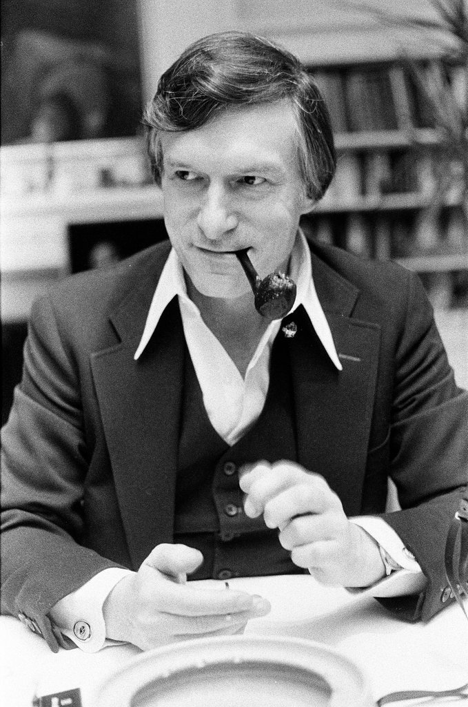 Hugh Hefner sits at desk - Chicago Sun-Times