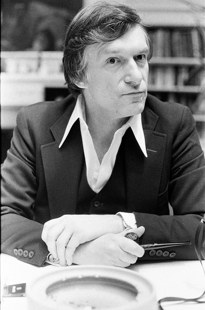 Hugh Hefner sits at desk - Chicago Sun-Times