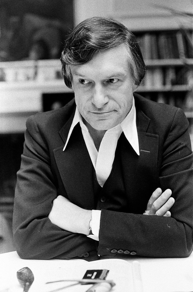 Hugh Hefner sits at desk - Chicago Sun-Times
