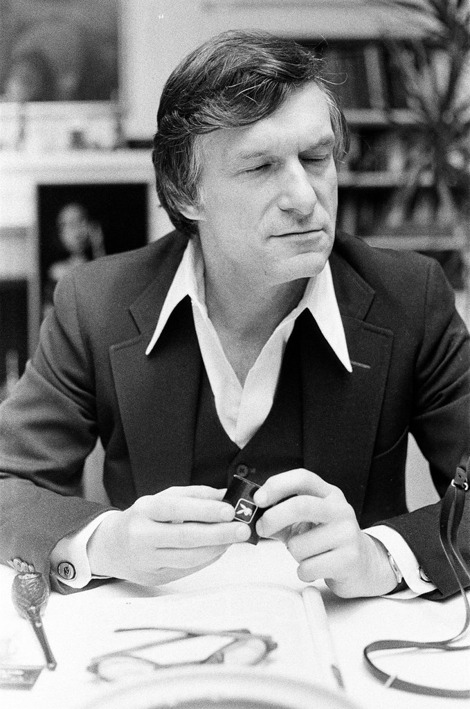 Hugh Hefner sits at desk - Chicago Sun-Times