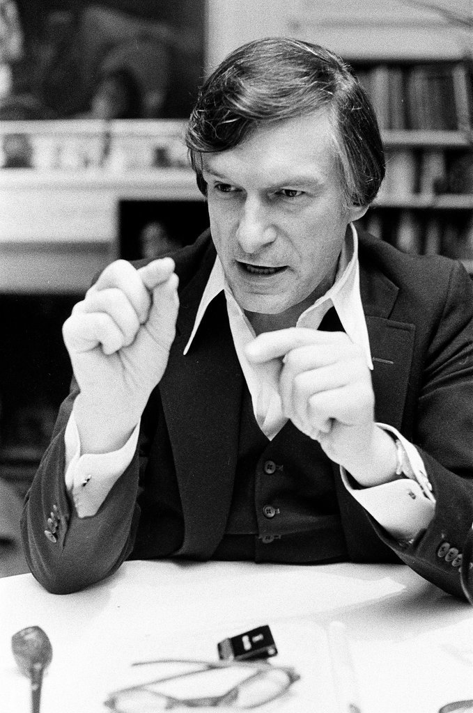 Hugh Hefner sits at desk - Chicago Sun-Times