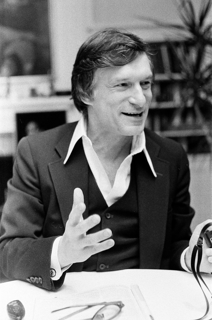 Hugh Hefner sits at desk - Chicago Sun-Times