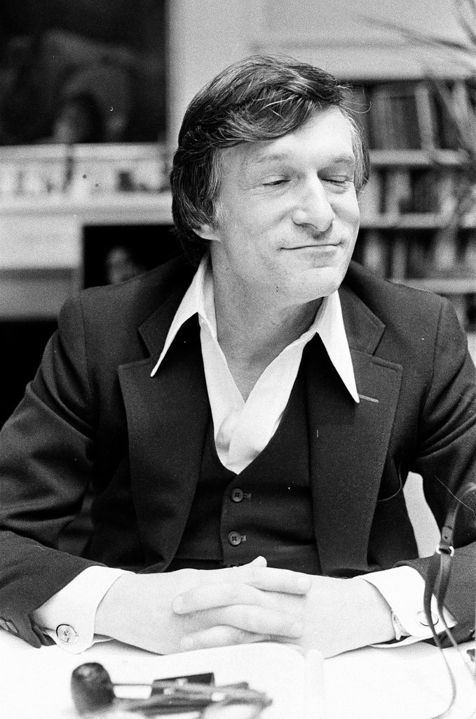 Hugh Hefner sits at desk - Chicago Sun-Times